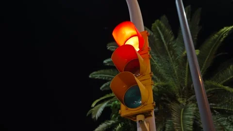 Close-up the traffic light on the pillar changes the light from red to green Stock Footage 244404291