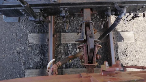 Close up of train carriage coupling hook connection between cars while moving Stock Footage 102334275