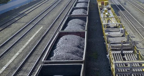 Close-up of Train with Coal. Locomotive Pulls Wagons on Rails. View from Above Stock Footage 136717392