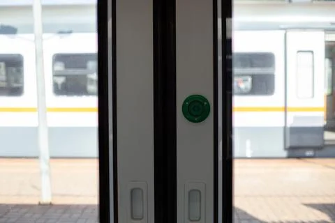 Close up of train door button that opens door for passengers. The image cap.. Stock Photos
