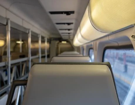 Close up of a train headrest with cargo space Stock Photos