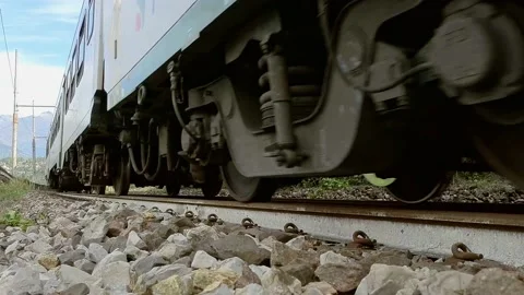 Close Up Train Passing on Train Tracks Stock Footage 140346667