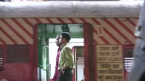 Close up of a train station from a moving train in Mumbai, India Stock Footage 11018805