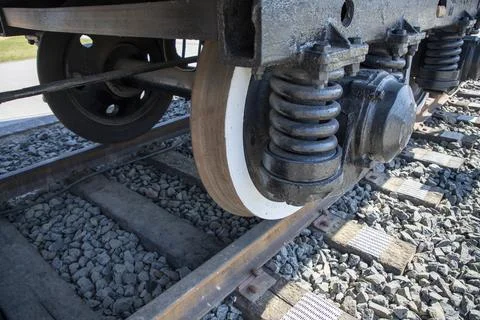 Close up of train wheels on railway tracks and wooden sleepers Stock Photos