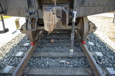 Close up of train wheels on railway tracks and wooden sleepers Stock Photos