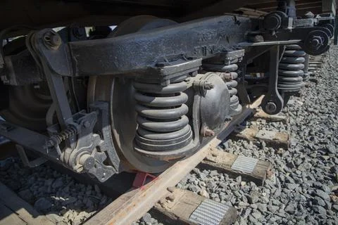 Close up of train wheels on railway tracks and wooden sleepers. Stock Photos
