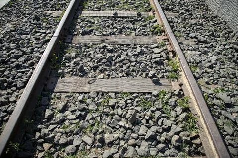 Close up of train wheels on railway tracks and wooden sleepers. Stock Photos