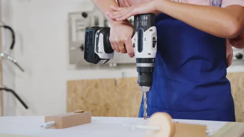 Close Up Of Trainees In Workshop Learning How To Use Power Tools To Assemble Stock Footage 130339330