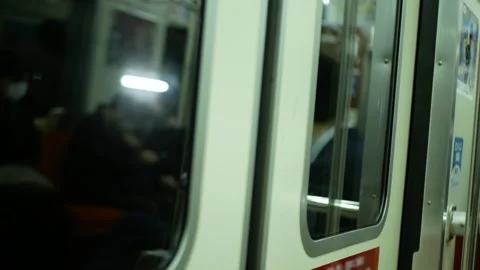 Close up to the train's door while the metro train is moving and arrive to .. Stock Footage 245343545