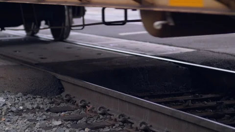 Close Up of a Train's Wheels Going Down the Railroad Tracks 動画素材 122420248