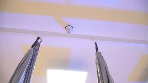 Close up, the transition from the ceiling on a girl floating in the hammock Stock Footage 70249180