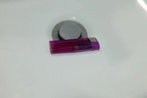 Close-up of a translucent purple disposable lighter Stock Photos