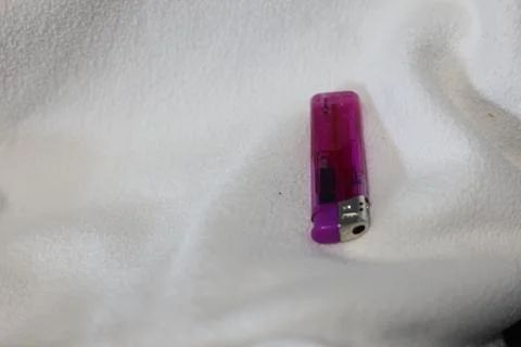 Close-up of a translucent purple disposable lighter Stock Photos