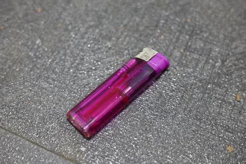 Close-up of a translucent purple disposable lighter Stock Photos