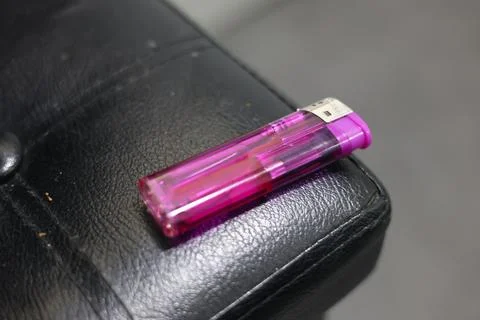 Close-up of a translucent purple disposable lighter Stock Photos
