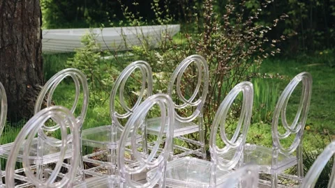 Close-up of the transparent chairs that stand at the ceremony Stock Footage 287701763