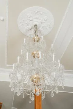 Close-up of transparent chandelier elements in bright interior. Concept of Fotos de archivo