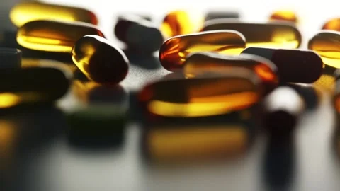 Close up of transparent tablets and colored pills Stock Footage 136473383