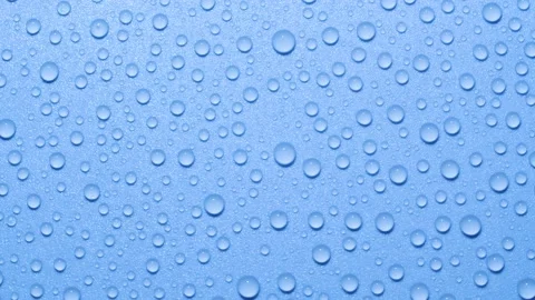 Close-up transparent water drops texture rotating on blue chroma key background 스톡 동영상 178320258