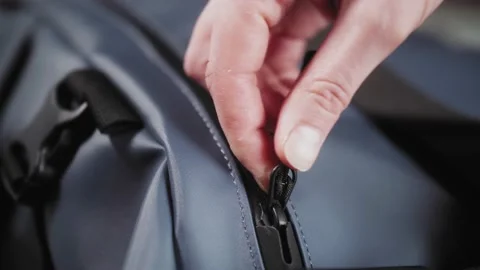 Close-up of travel backpack. Hands close suitcase. Stock Footage 142927940