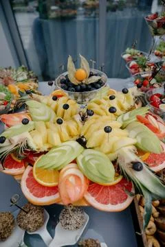 Close-up of a tray with pineapple, grapefruit, mango carvings Stock Photos