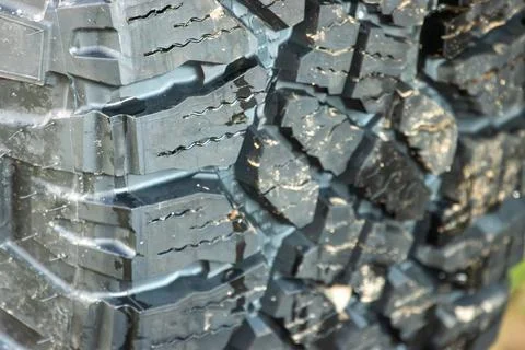 A close-up of the tread on a tire Stock Photos