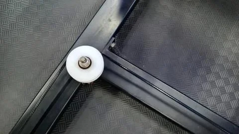 Close-up of a treadmill corner with wheel and textured surface Stock-Fotos