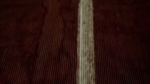 Close-up of treadmill. Slow motion. The camera moves along the white line. Stock Footage 255360038