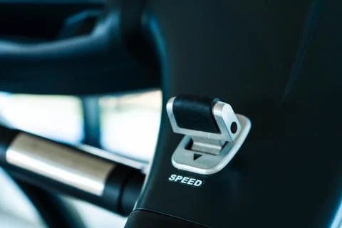 Close-up of the treadmill speed adjustment button Photos