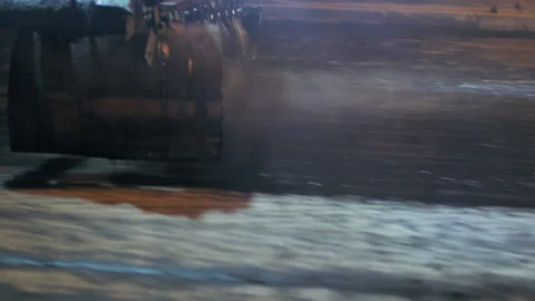 Close-up treatment of the road surface with bitumen emulsion. Emulsion filling Stock-Footage 153380569