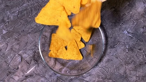 Close up. Triangle nachos corn chips in a glass plate. Best vegan nachos Stock Footage 120609755