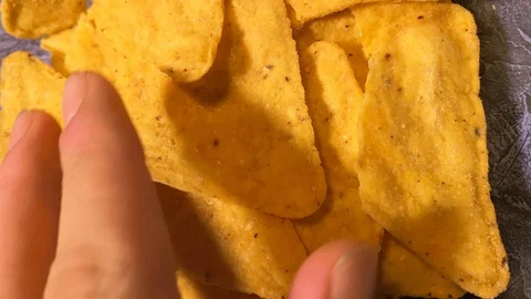 Close up. Triangle nachos corn chips in a glass plate. Best vegan nachos Video stock 120609801