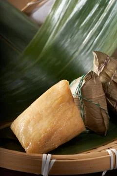 Close-up of triangular rice dumplings on background of traditional Chinese Drago Stock Photos