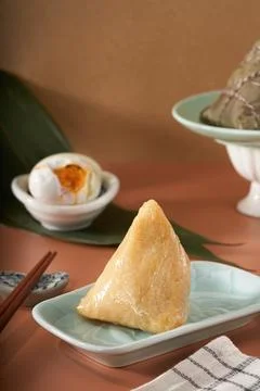 Close-up of triangular rice dumplings on background of traditional Chinese Drago 写真素材