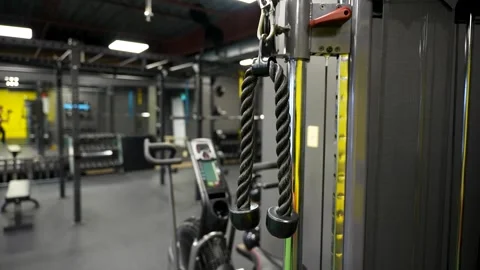 Close up triceps rope attachment on functional trainer in studio gym Stock Footage 330620671