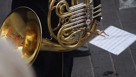 Close-up of a trombonist performing at a parade, highlighting the instrumen.. Video stock 248755341