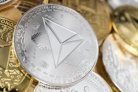 Close-up of tron physical coin on stack of many other cryptocurrencies Stock Photos