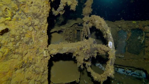 Close-up of truck cab lying on its side inside hold of wreck Salem Express ferry Stock Footage 311865026
