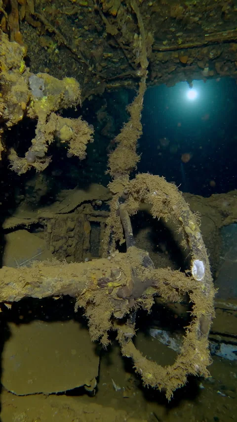 Close-up of truck cab lying on its side inside hold of wreck Salem Express ferry Stock Footage 336924720