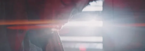 Close up of a trumpeter playing with light effect on the background Stock Footage 202320309