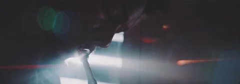 Close up of a trumpeter playing with light effect on the background Stock Footage 202320335