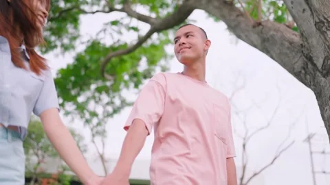 Close-up of a trusting man, holding hands, enjoying, relaxing, walking, forward  Stock Footage 265229440