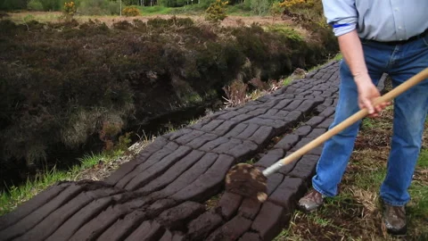 Close up on turf cutting in the bog Stock-Footage 132058374