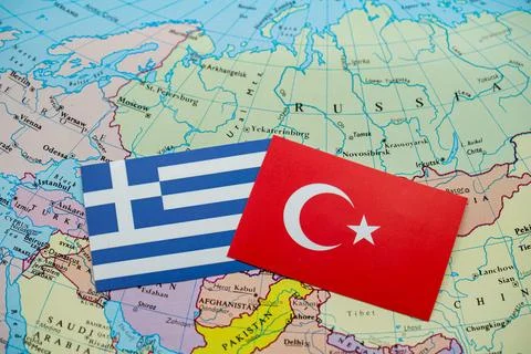 Close up of Turkey and Greece flags on world map Stock Photos