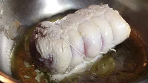 Close up, turkey roll cooks in the pot Stock Footage 121330616