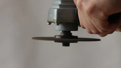 Close-up, turn on a hand side grinder Stock Footage 97641935