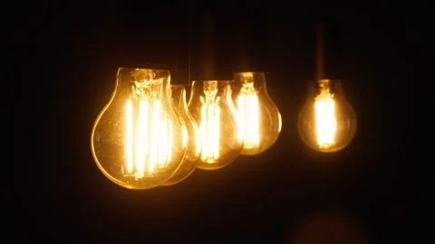 Close-up of the turning on and off of the light bulbs in the room. Stock Footage 315285107