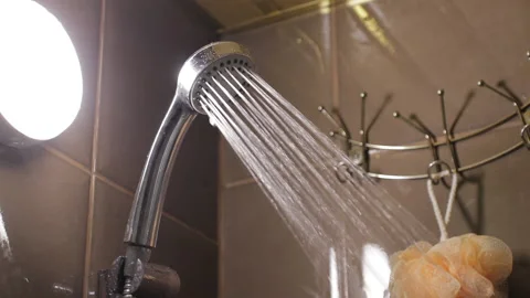 Close-up of turning on and off shower head in bathroom Stock Footage 148380859
