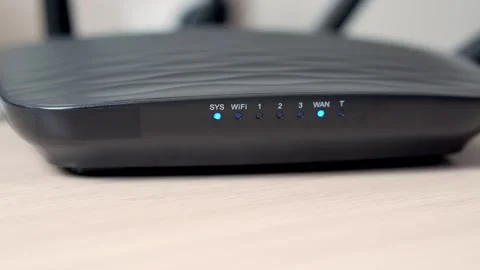 A close-up of turning on a black Wi-Fi router. Router flashes lights. Stock Footage 251854810