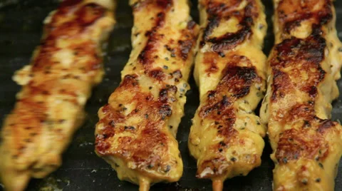 Close Up Turning Chicken Kebabs In Pan Stock Footage 38863320